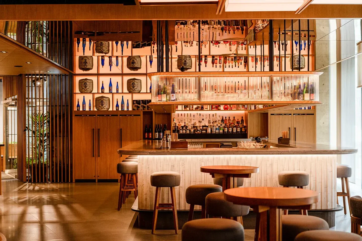 Stylish bar interior at Nobu Warsaw with a warm, inviting atmosphere.