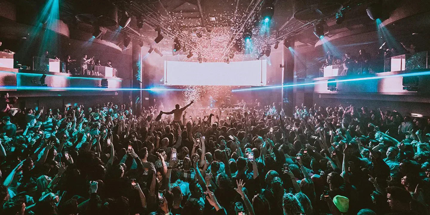 Energetic crowd at Nova nightclub in San Diego, confetti falling on the dance floor.