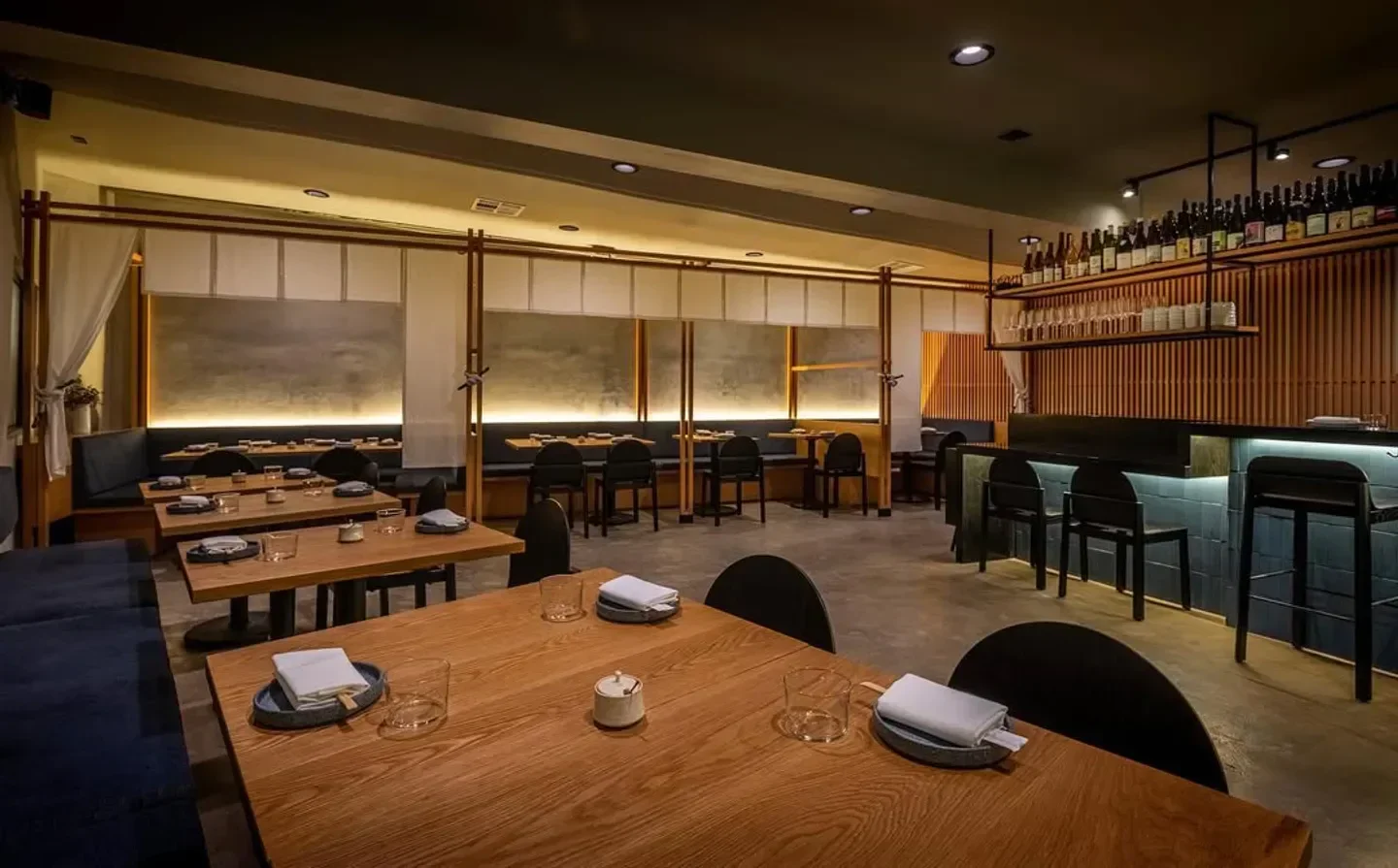 Interior of n/soto restaurant in Los Angeles, featuring wooden tables and bar