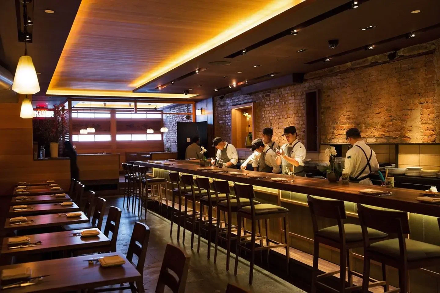 Interior of O Ya restaurant in Boston with chefs at the sushi bar