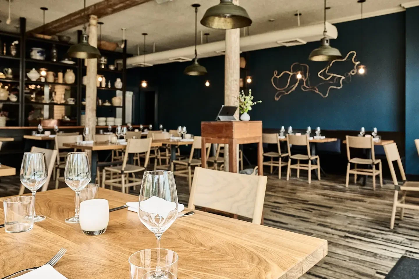 Interior dining at Octavia restaurant in San Francisco with tables and decor