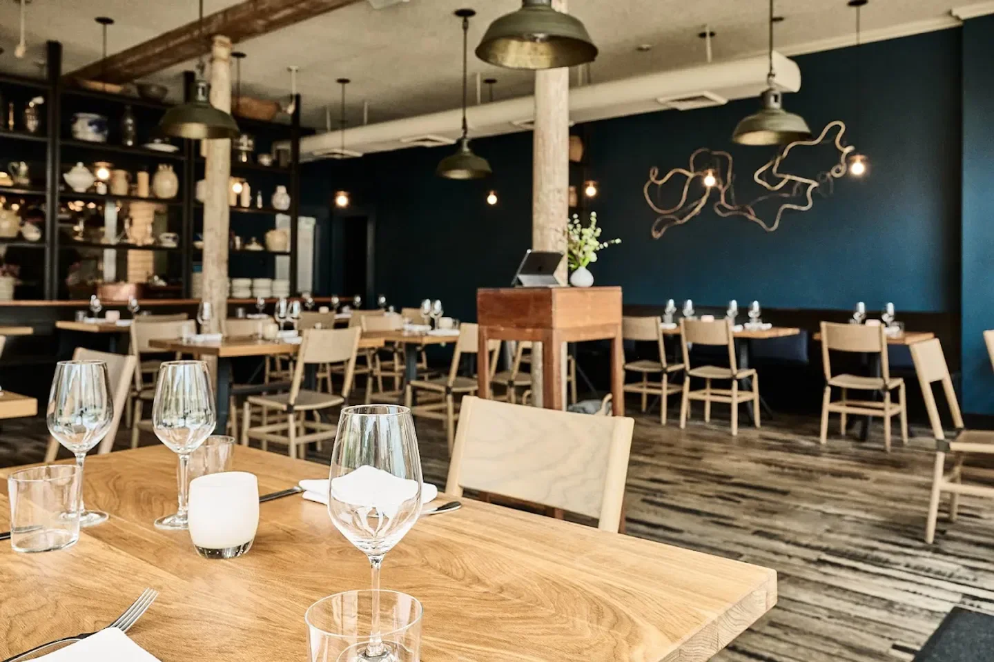 Interior dining at Octavia restaurant in San Francisco with tables and decor