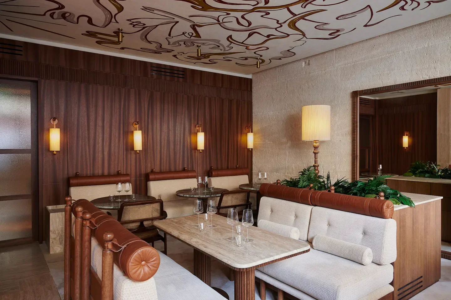 Interior of Oka restaurant in Paris, featuring elegant design and stylish seating.