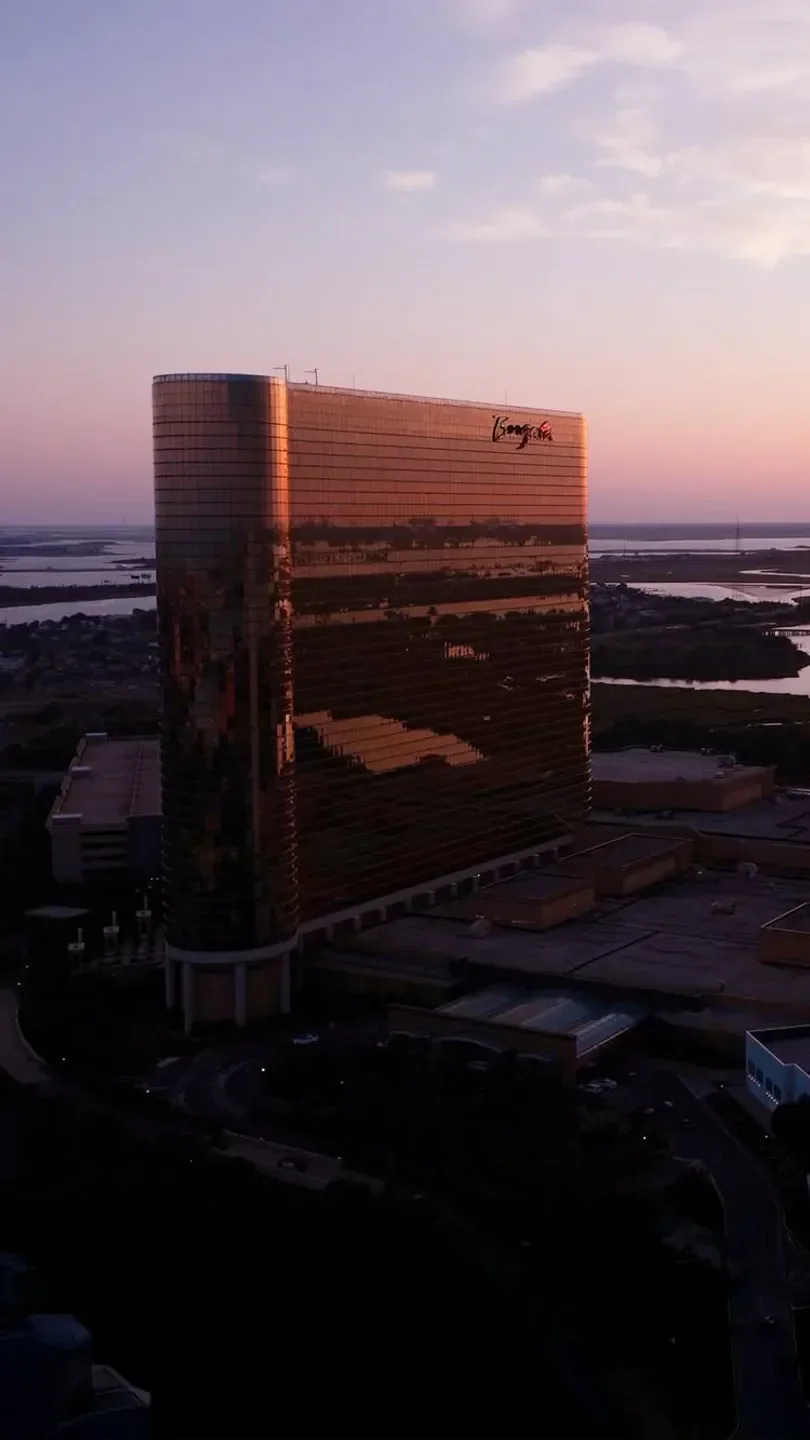 Aerial view of Old Homestead Steak House in Atlantic City at sunset, golden building