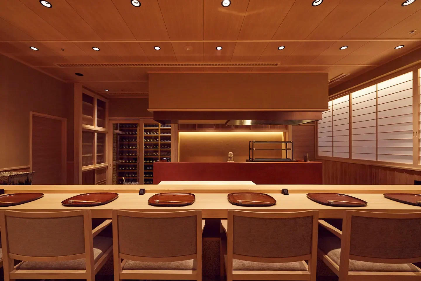 Interior of Oniku Karyu restaurant in Tokyo, featuring seating and kitchen counter.