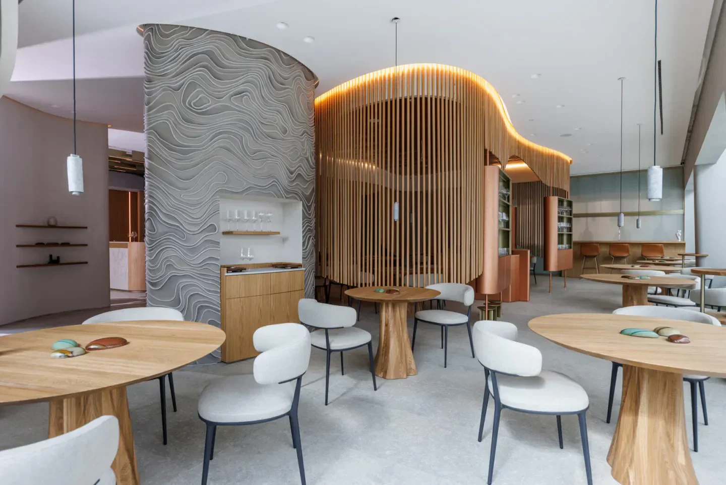 Stylish interior of Orma Roma restaurant in Rome, featuring modern design and wooden accents.