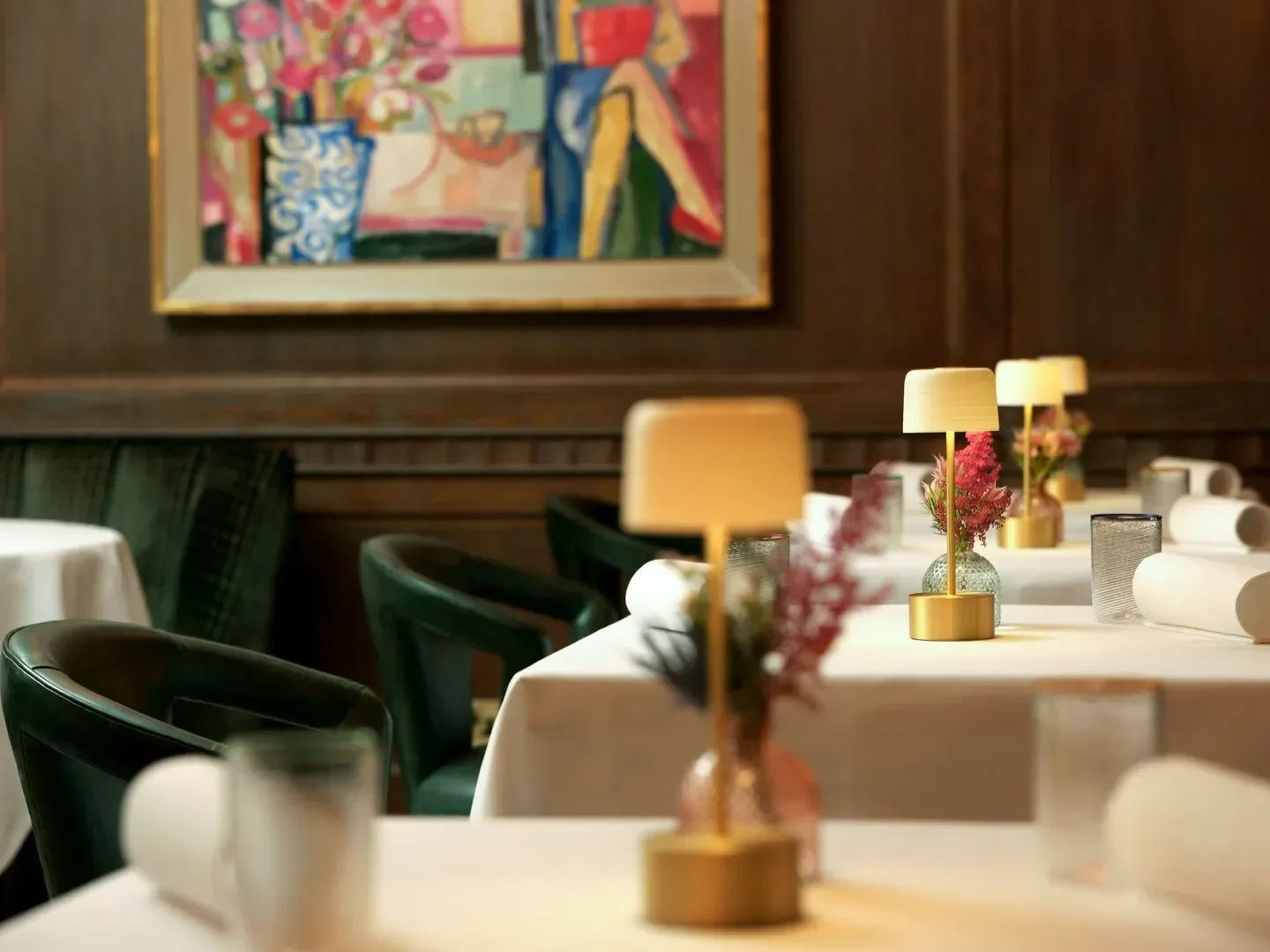 Elegant dining at Ormer Mayfair by Sofian in London, featuring chic table settings.