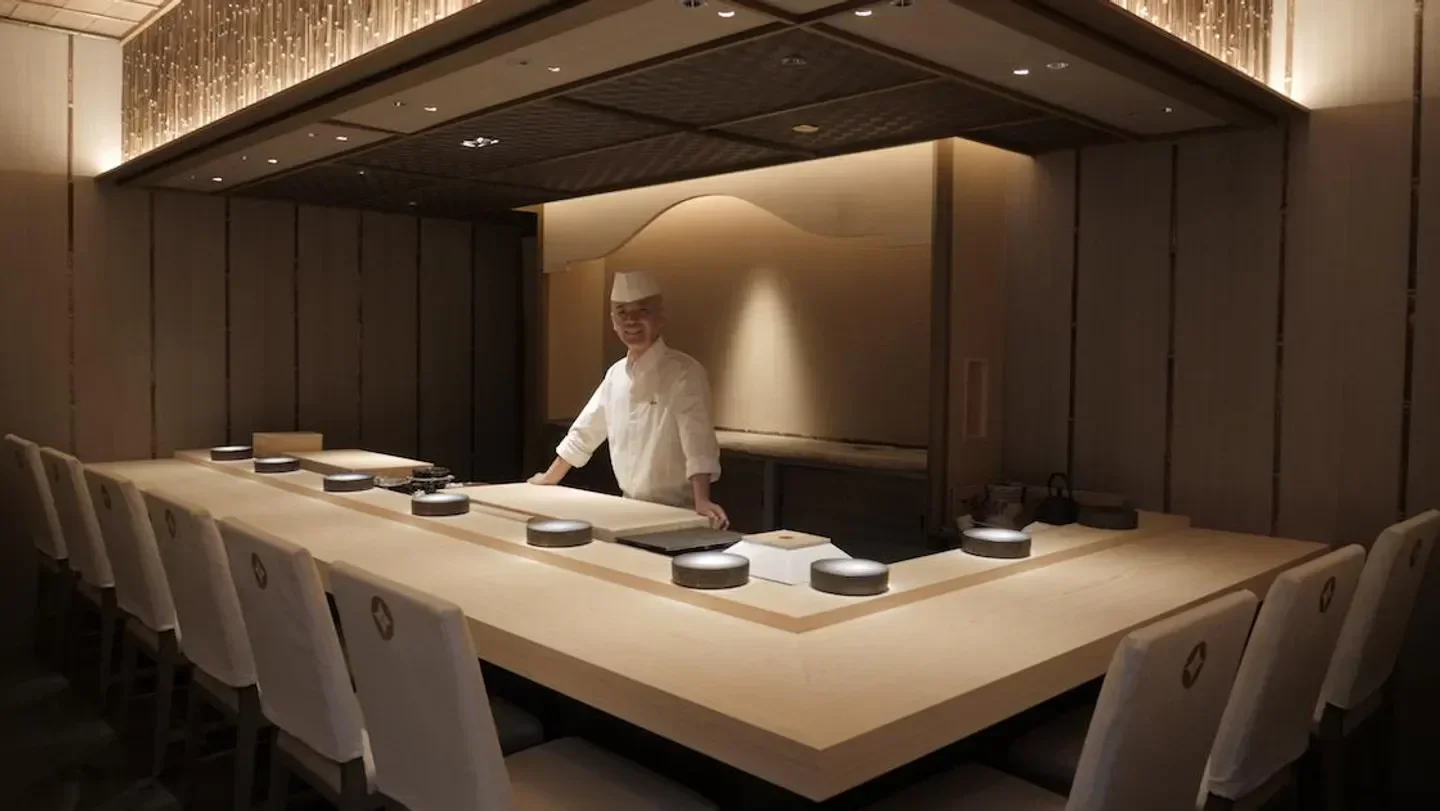 Chef at Oshino Singapore, a modern sushi restaurant with an elegant dining experience.
