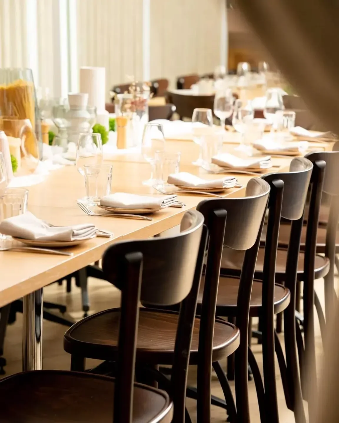 Dining setup at Osteria Coogee in Sydney, featuring elegant tables and chairs.