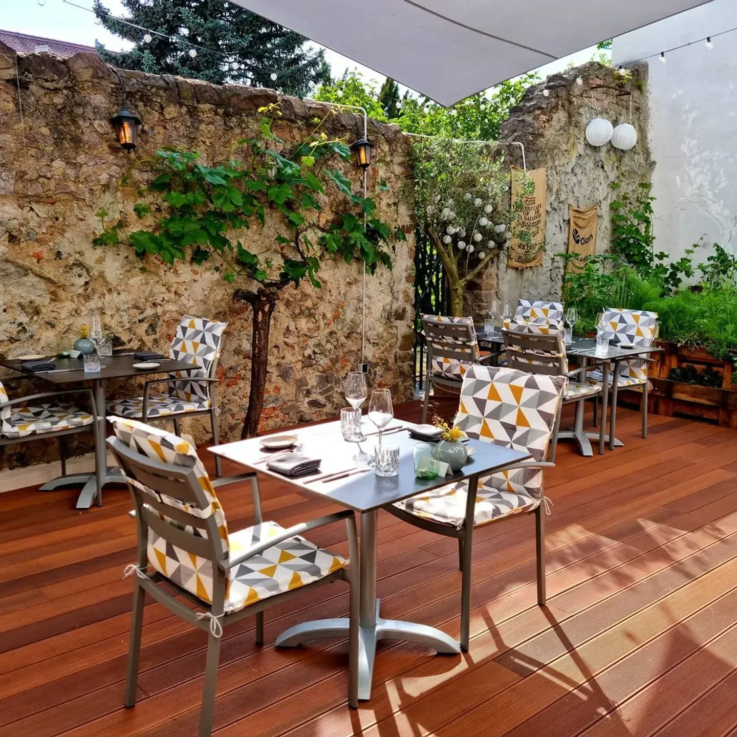 OX restaurant in Frankfurt outdoor seating area, cozy and inviting with wooden deck.
