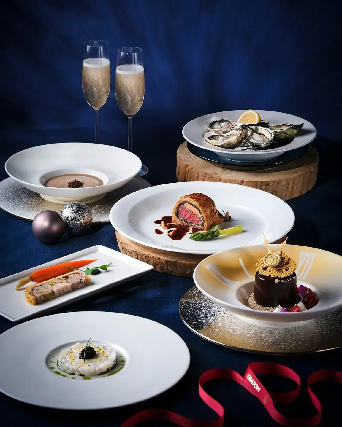 Delectable dishes at Oyster & Wine Bar in Hong Kong, including oysters and champagne.