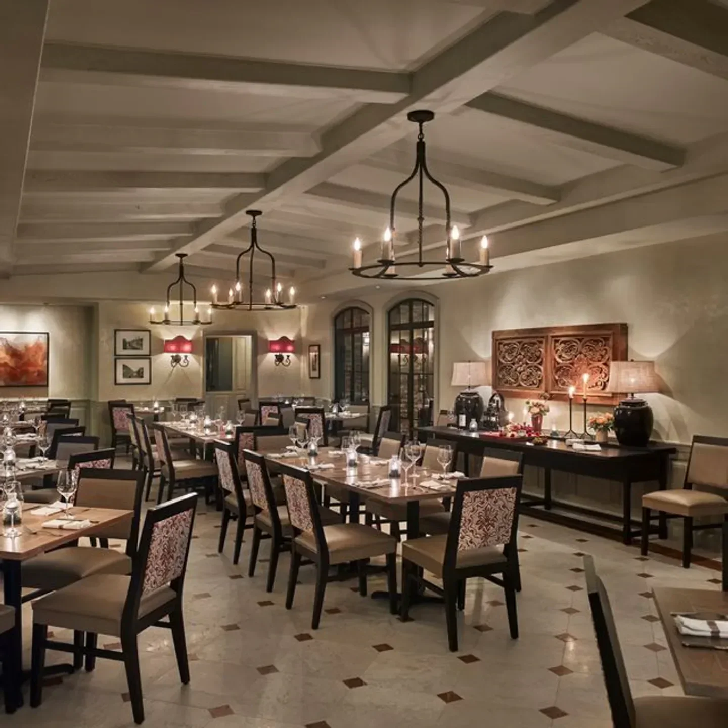 Elegant interior of Panorama restaurant in Philadelphia, showcasing tables and chandeliers.