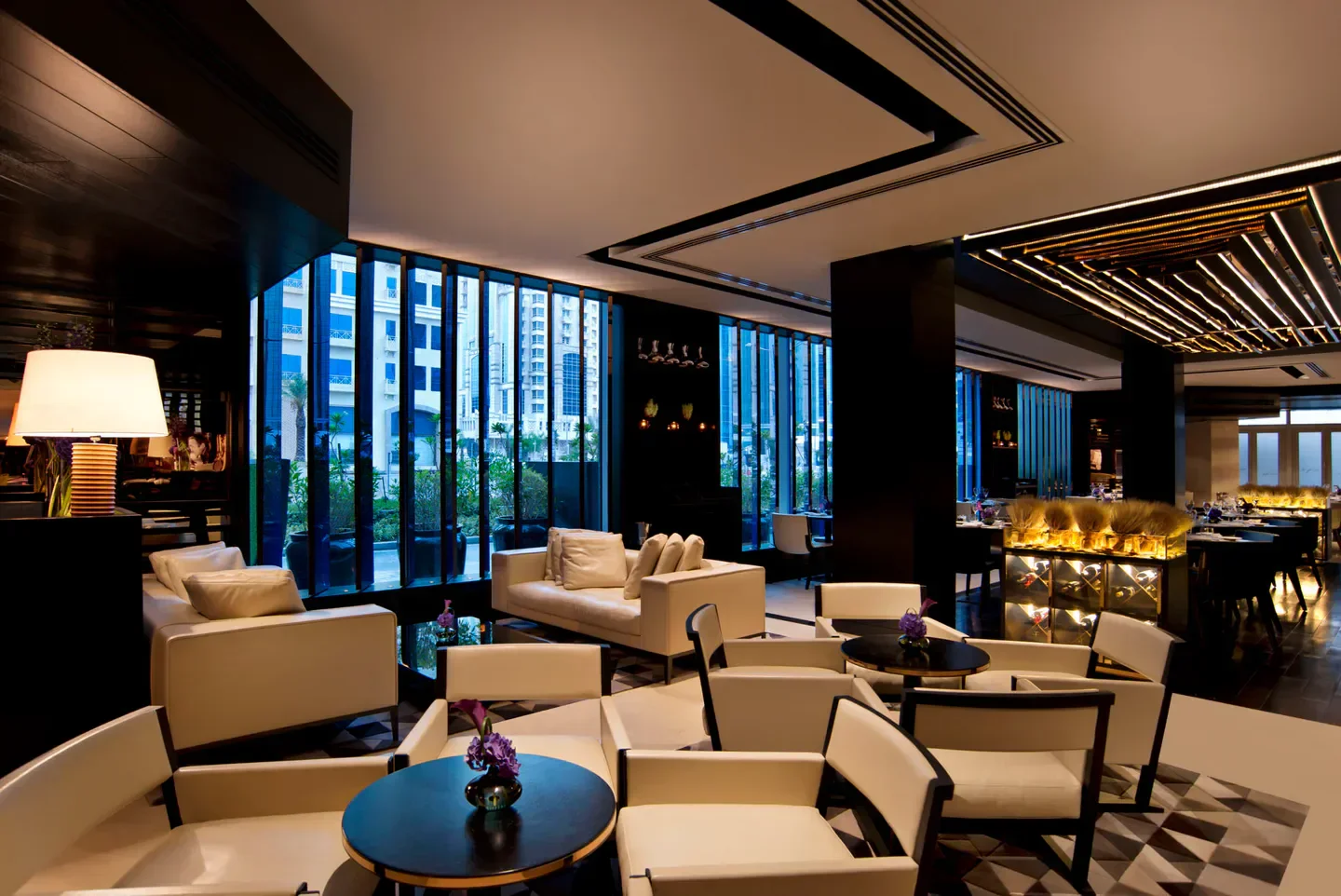 Stylish interior seating at Paper Moon restaurant in Doha, with modern design and ambiance.