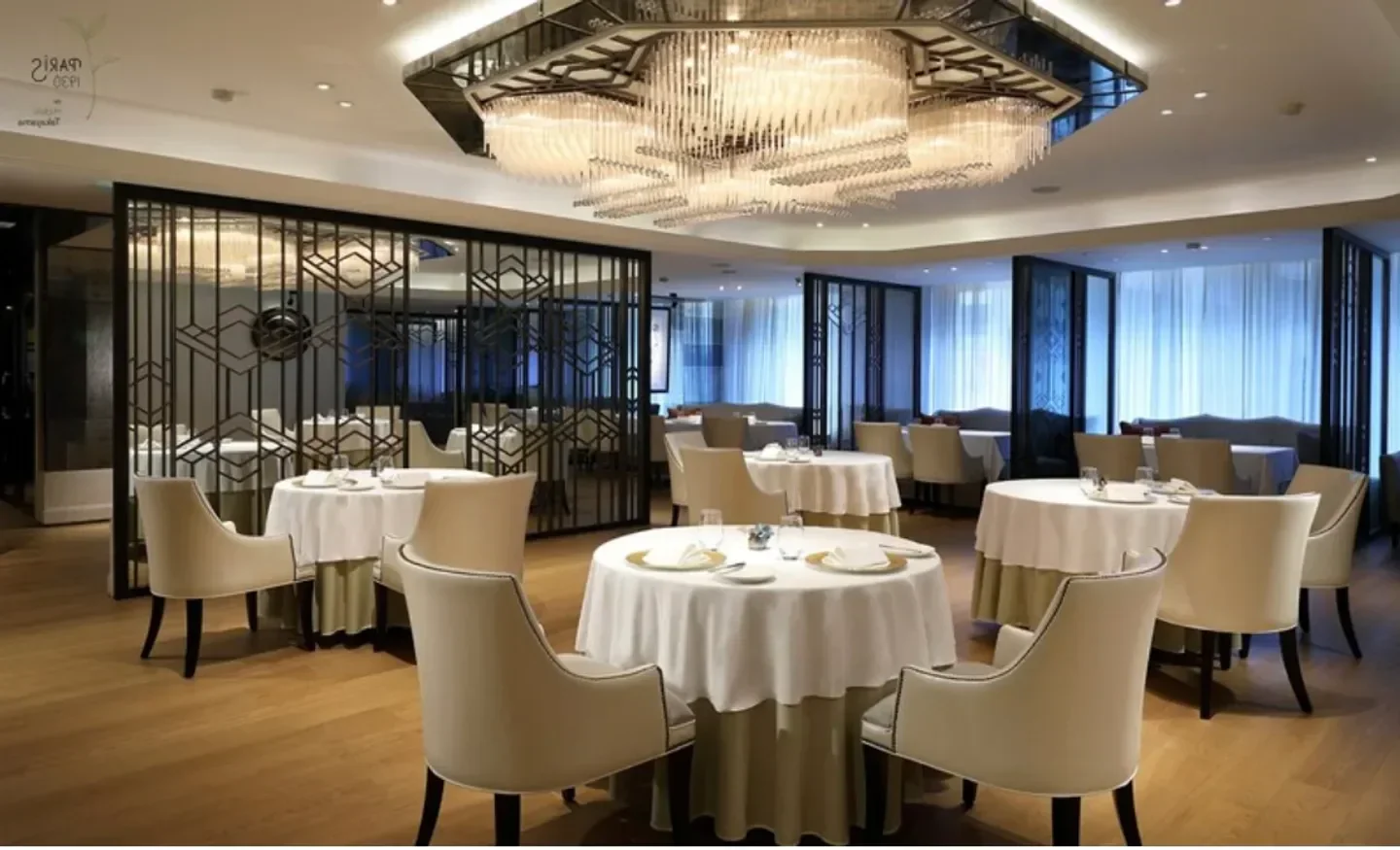 Elegant interior of Paris 1930 de Hideki Takayama restaurant in Taipei, featuring round tables