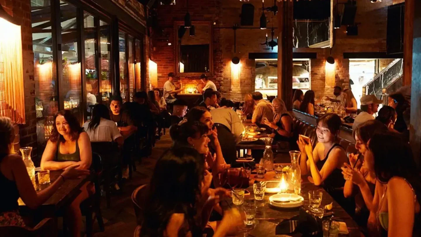 Cozy interior of Parlour restaurant in Toronto with patrons enjoying the evening