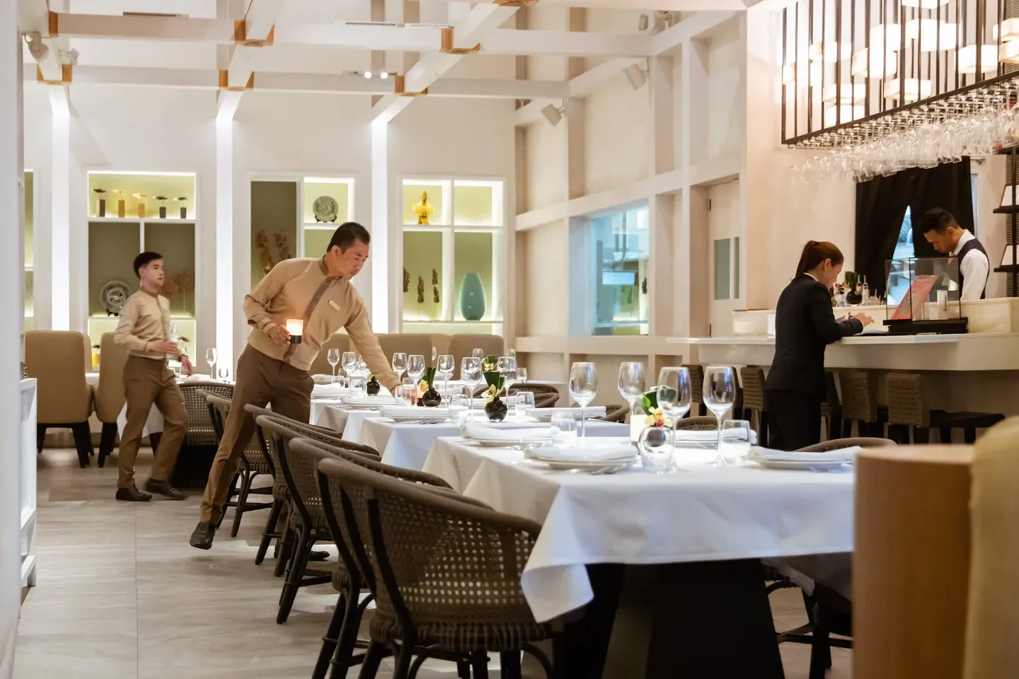 Elegant dining room at Paste restaurant in Bangkok, set for a refined experience.