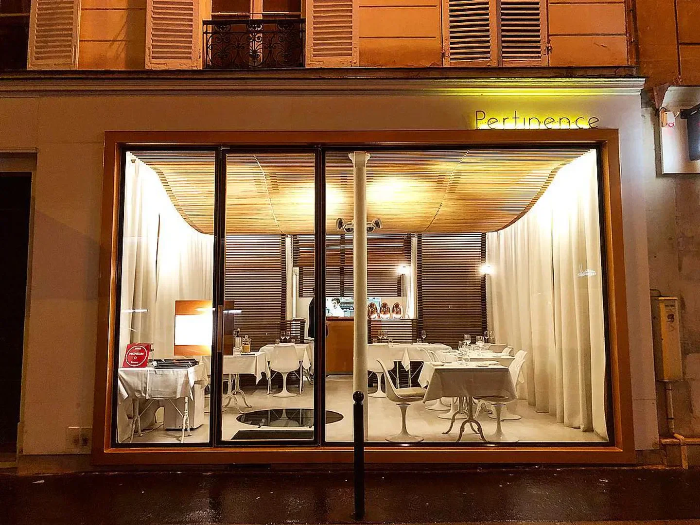 Exterior view of Pertinence restaurant in Paris, showcasing elegant dining room