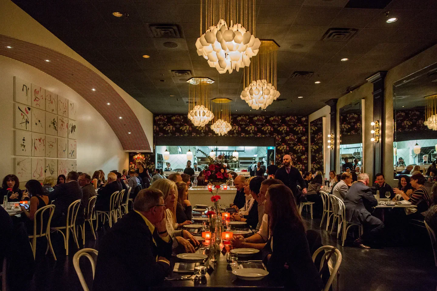 Dining scene at Piano Piano restaurant in Toronto, with unique lighting and art