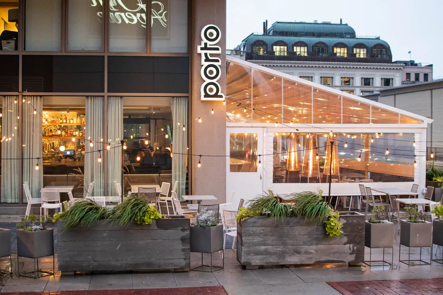 Outdoor patio at Porto restaurant in Boston, with string lights and heaters.