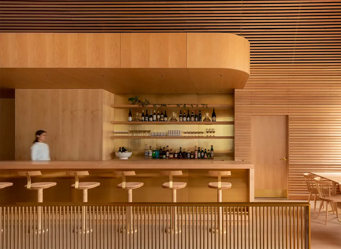 Interior of Prime Seafood Palace in Toronto, featuring a stylish bar with stools.