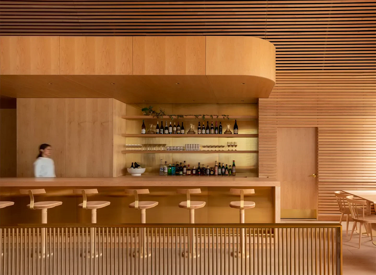 Interior of Prime Seafood Palace in Toronto, featuring a stylish bar with stools.