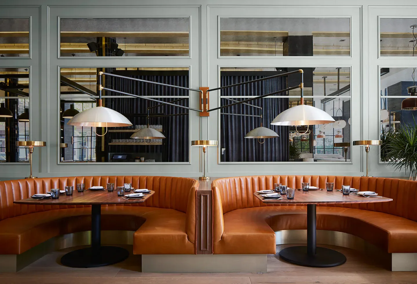 Stylish interior with booths at Proxi restaurant in Chicago with warm lighting and decor.