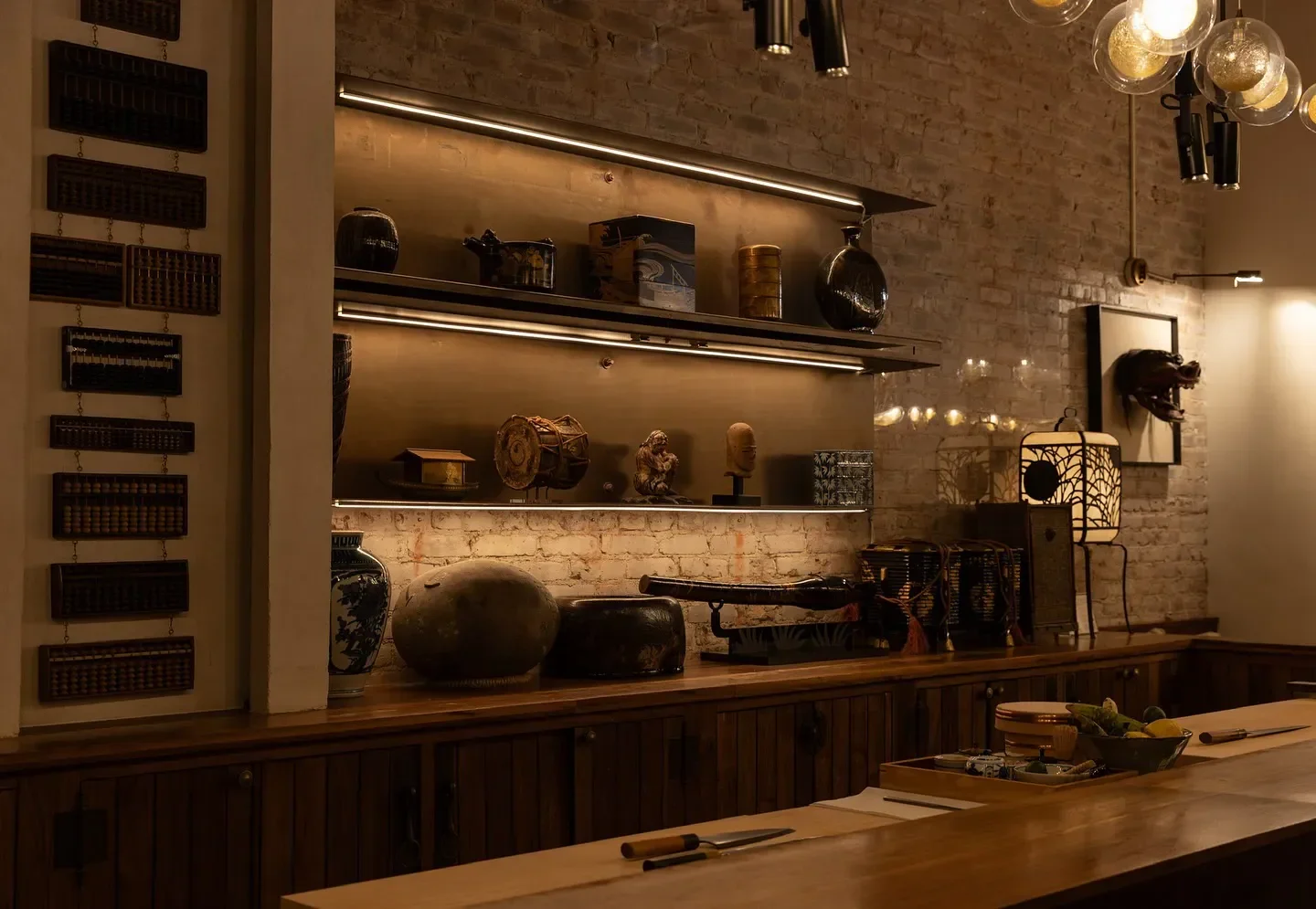 Interior design at Q Sushi in Los Angeles featuring decorative shelves and bar seating