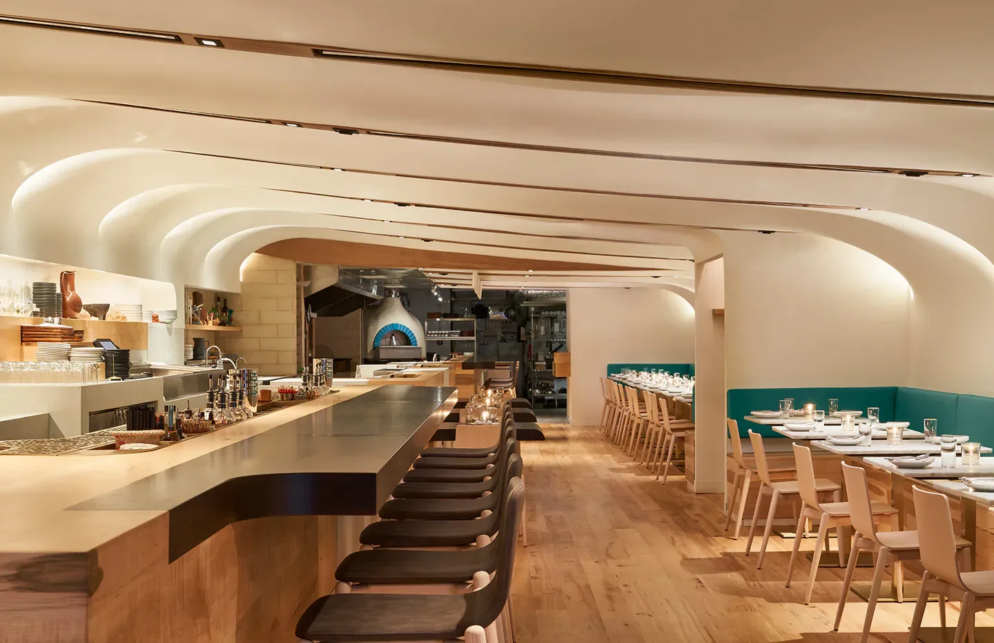 Interior view of Quetzal restaurant in Toronto, featuring a stylish bar and dining area