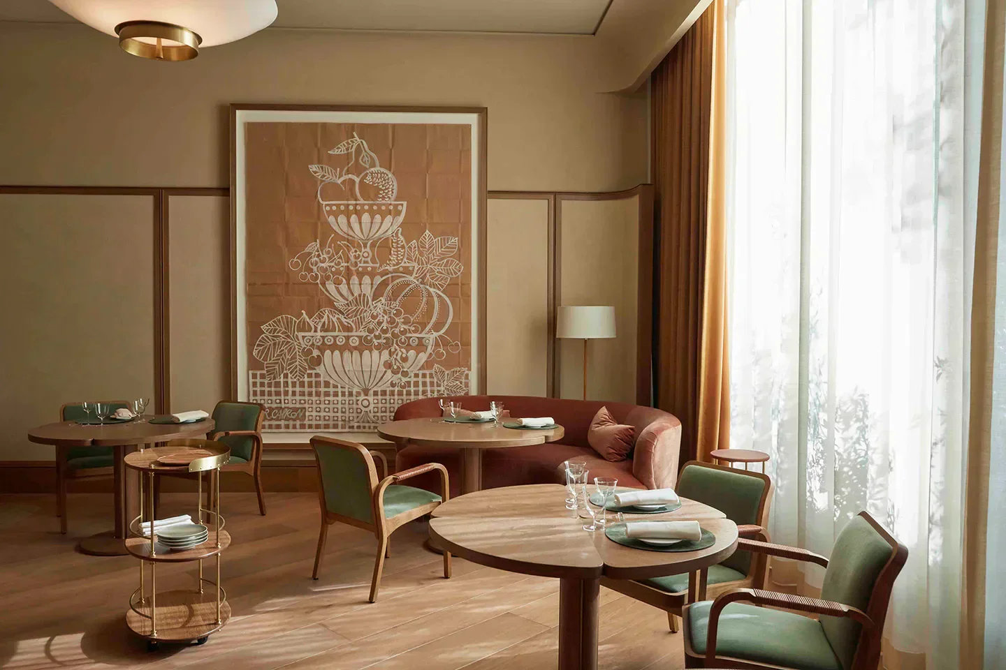 Elegant dining area at Quince restaurant in San Francisco with a large artwork