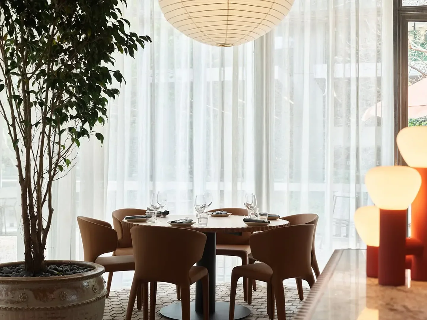 Elegant dining at RAFI restaurant in Sydney, featuring stylish table setting and decor.