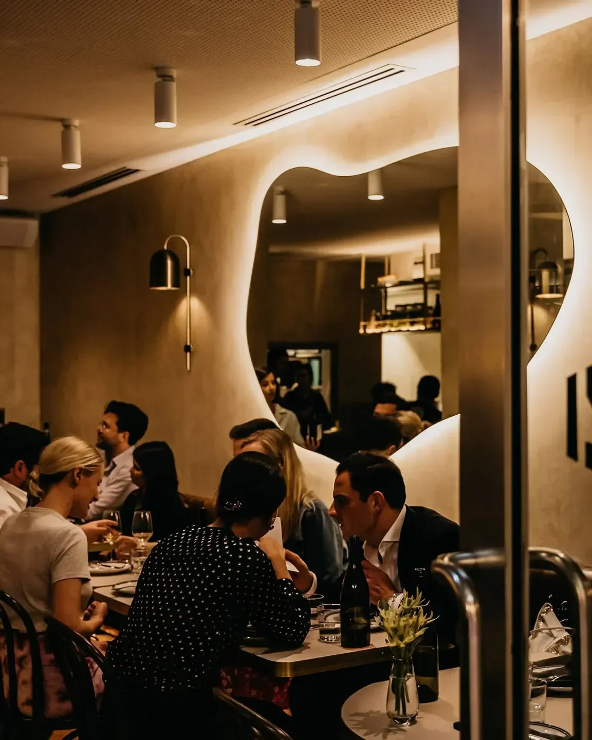 Cozy interior of Ragazzi Wine & Pasta in Sydney, with diners enjoying the evening