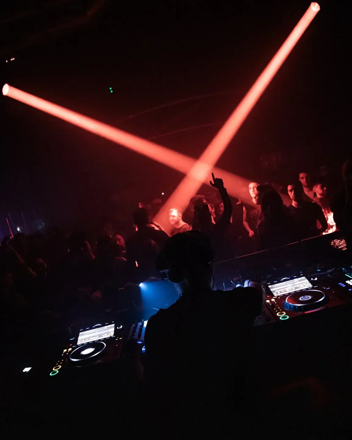 DJ set at Razzmatazz nightclub in Barcelona with dramatic red stage lighting
