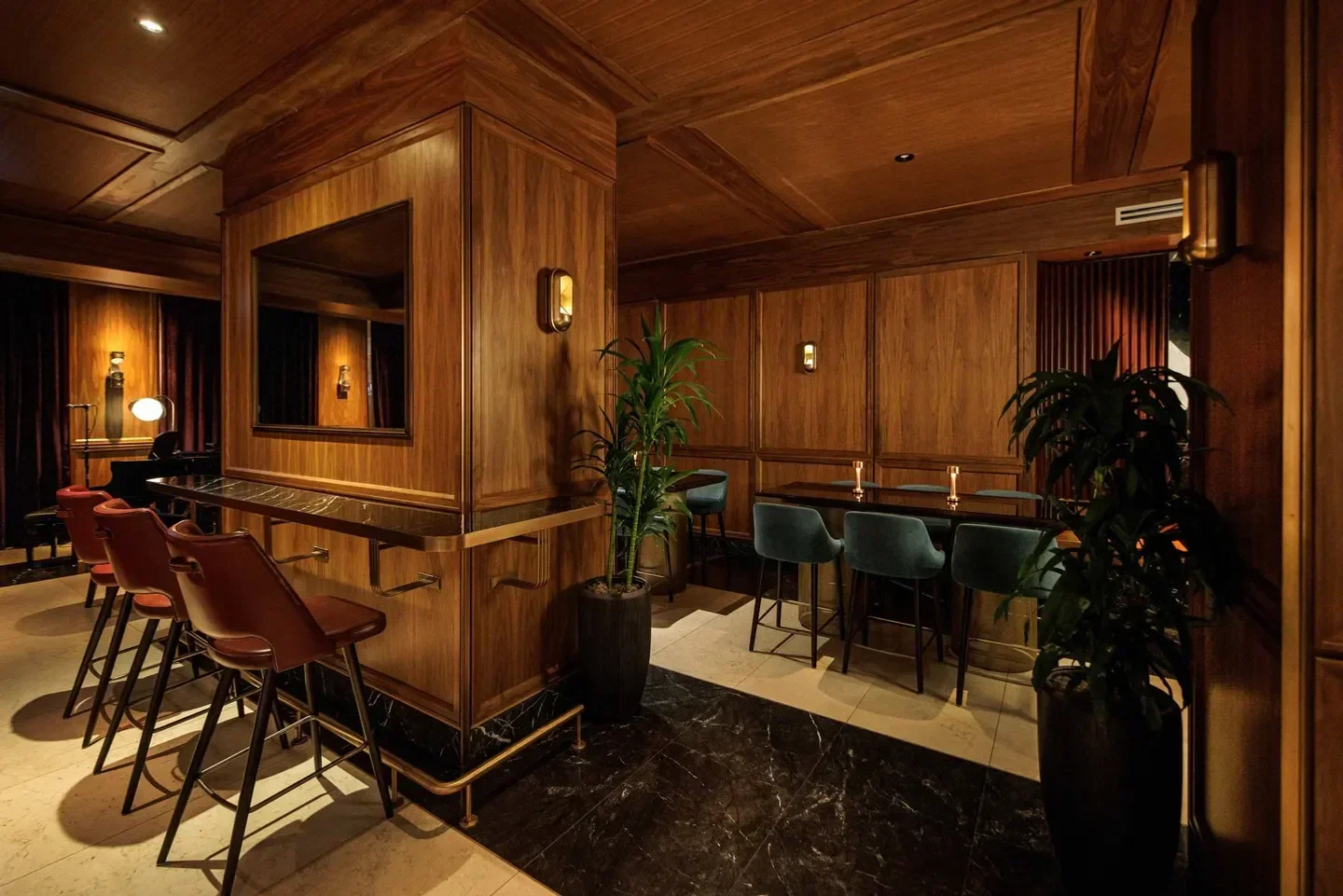 Interior of REIGN Restaurant in Toronto, featuring wood paneling and bar seating.