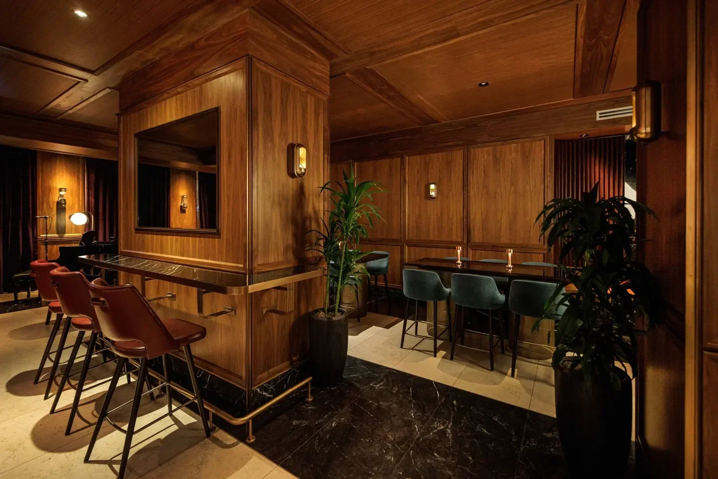 Interior of REIGN Restaurant in Toronto, featuring wood paneling and bar seating.