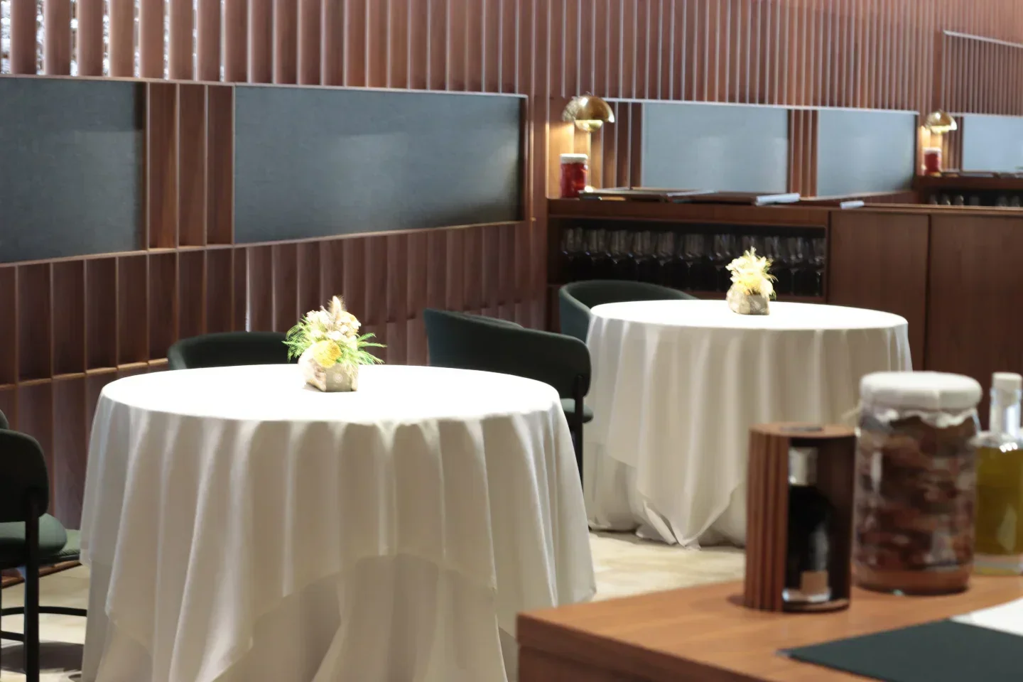Elegant interior of Ricard Camarena restaurant in Valencia with tables set for dining.