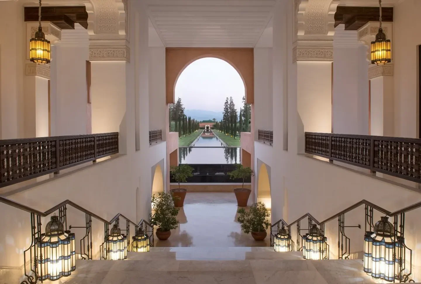 Rivayat restaurant in Marrakech: Grand staircase leading to a serene exterior view