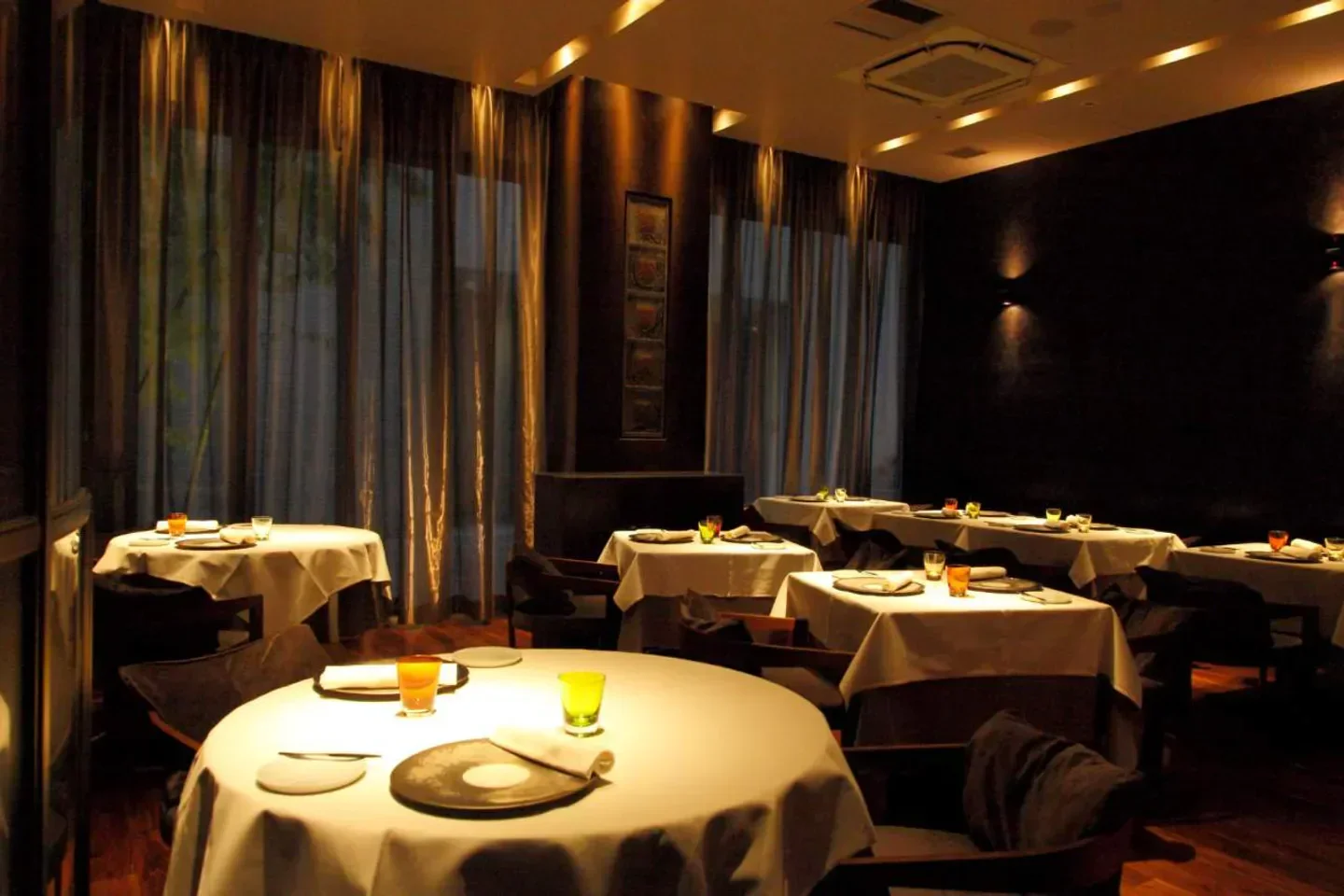 Cozy dining room at Ryuzu restaurant in Tokyo, featuring elegant table settings and ambiance.