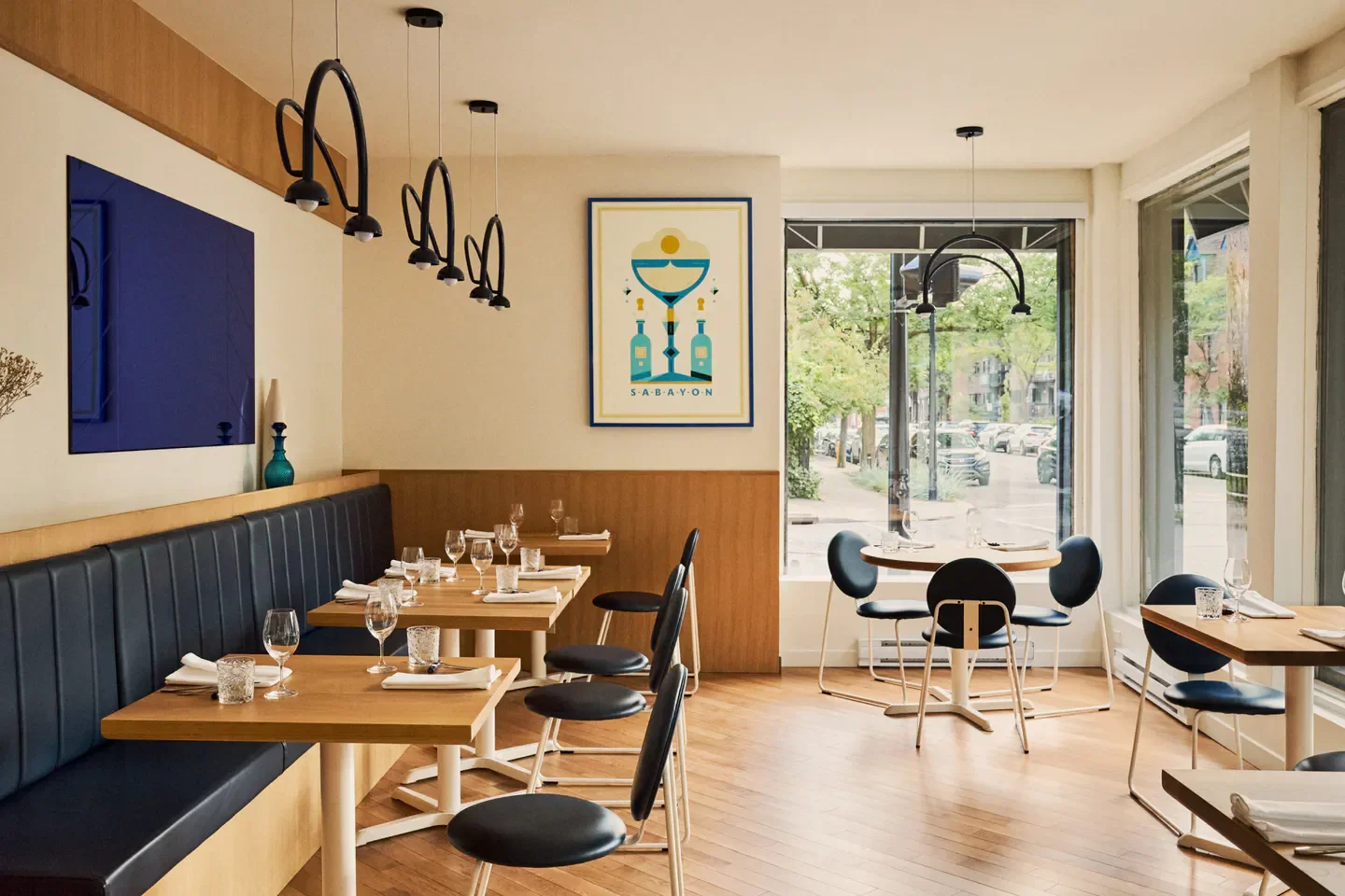 Interior of Sabayon restaurant in Montreal, featuring stylish decor and dining tables.