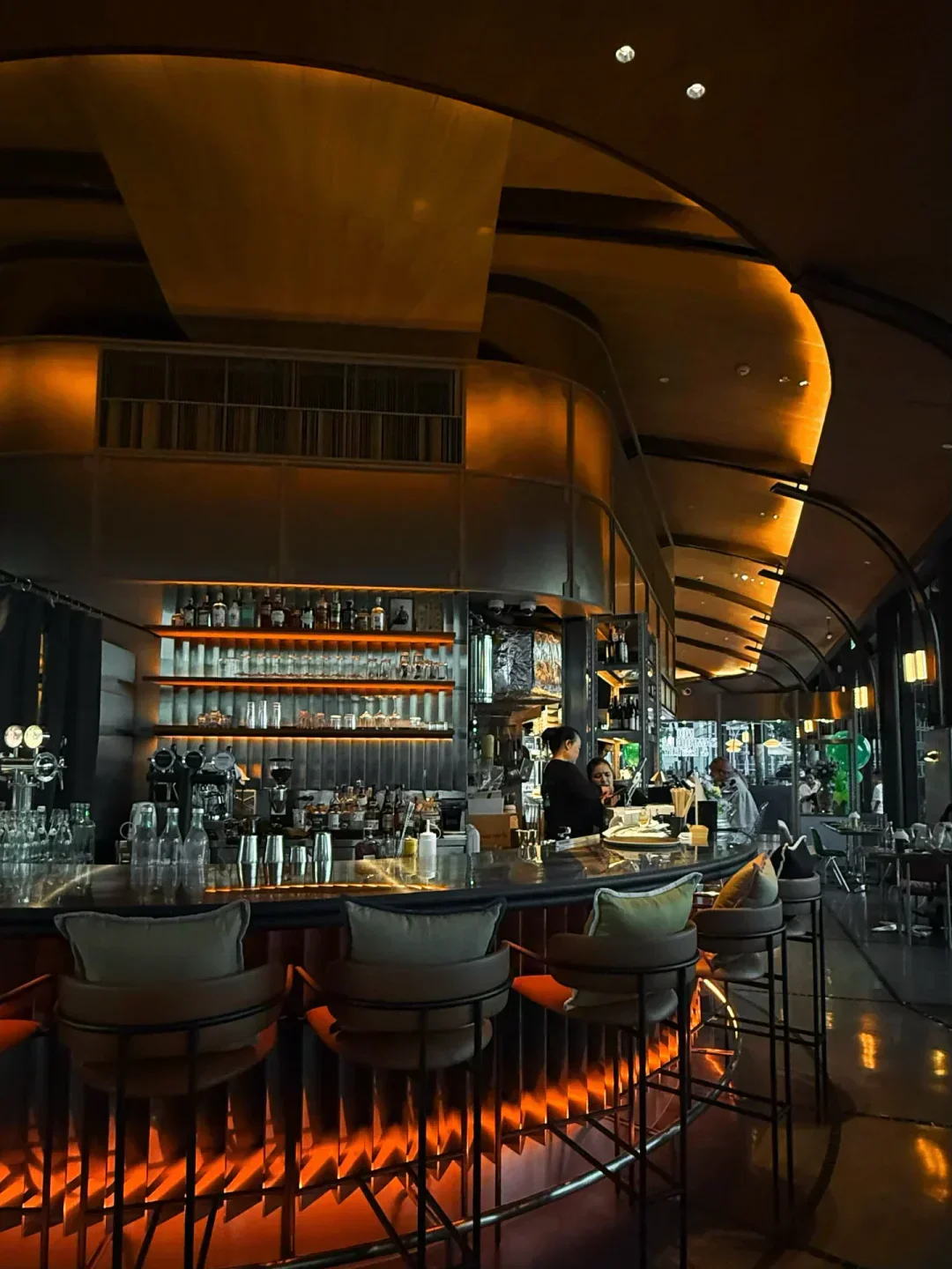 Interior of Samrub Samrub Thai restaurant, showcasing its bar in Bangkok.