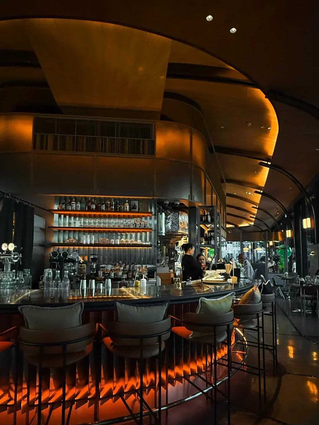 Interior of Samrub Samrub Thai restaurant, showcasing its bar in Bangkok.