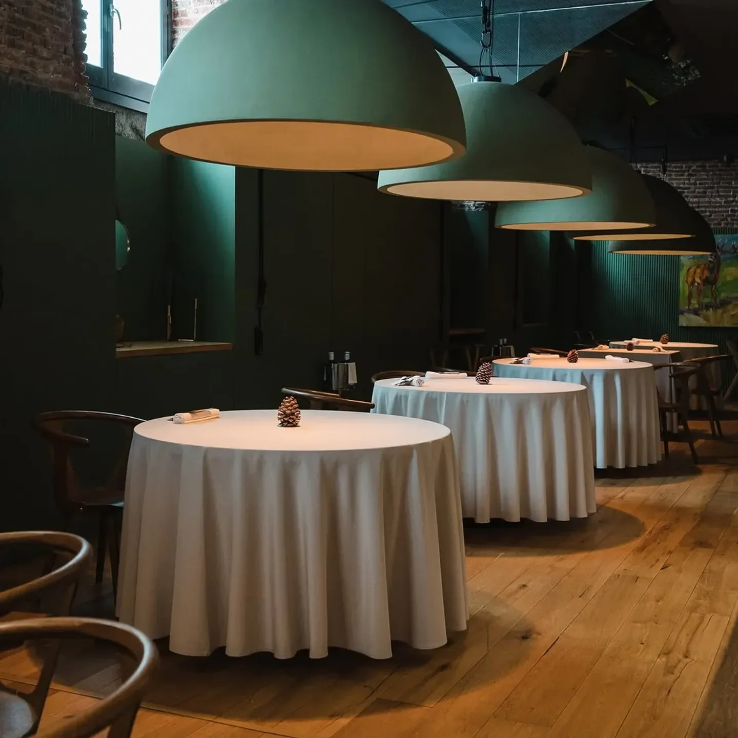 Elegant dining room interior at Santerra restaurant in Madrid, featuring soft lighting and tables