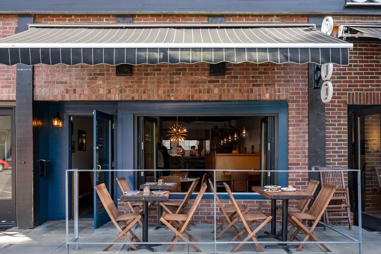 Seabird restaurant in Seattle with outdoor seating and stylish decor.