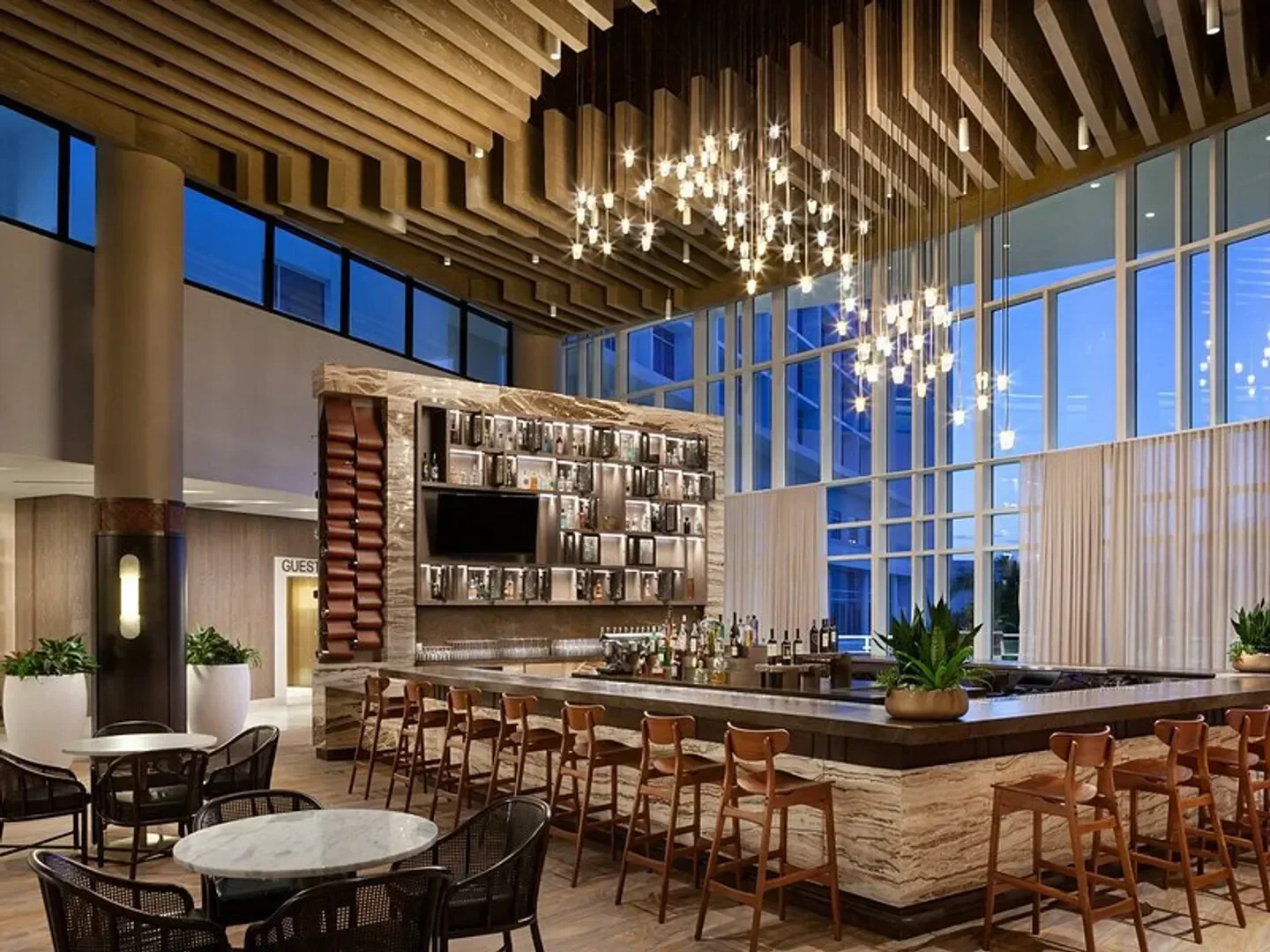 Interior of Sear Sea restaurant in Orlando, featuring a bar, tables, and ambient lighting.