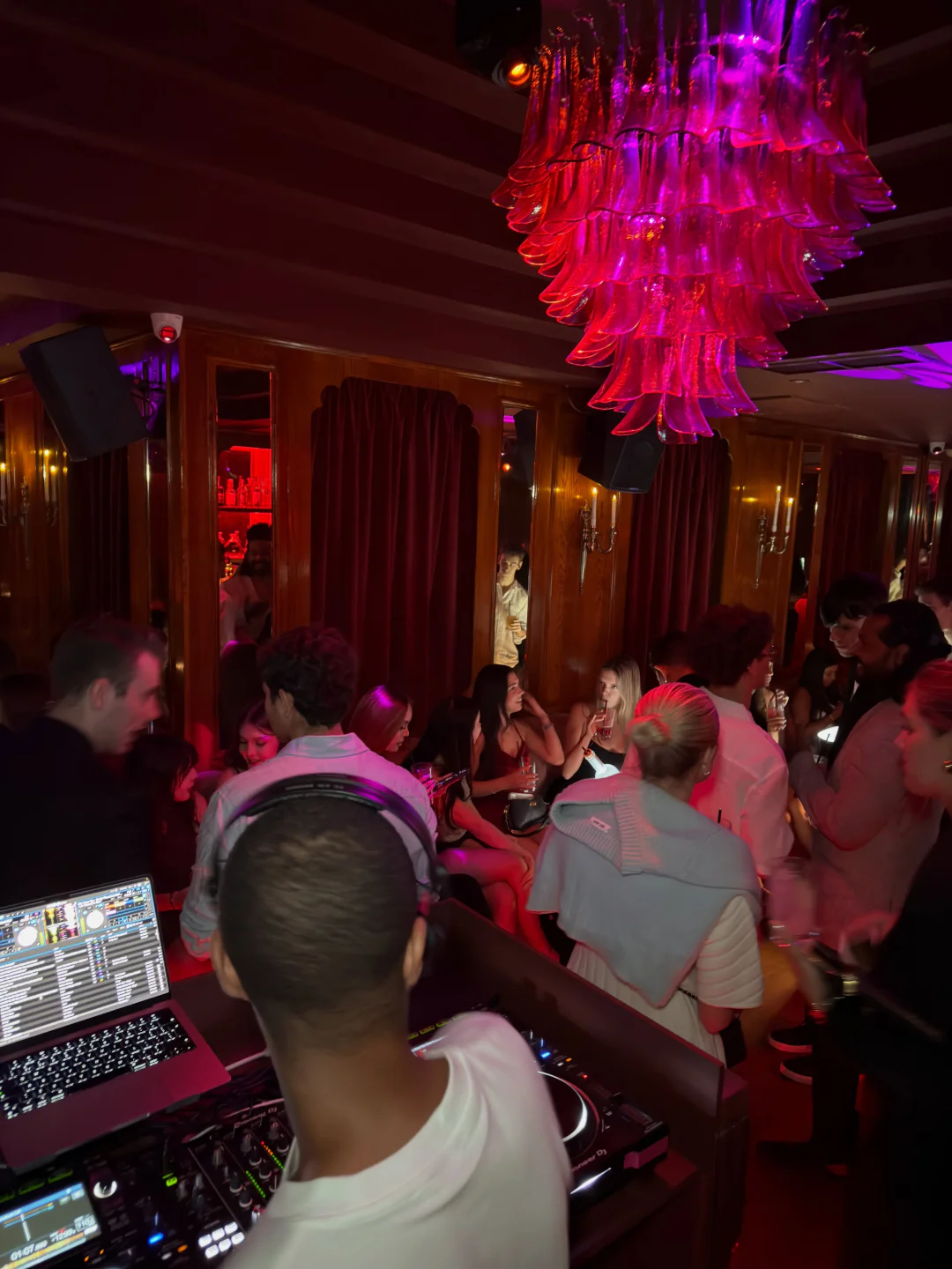 Lively crowd enjoying the night at Selene Club in London with a DJ booth visible