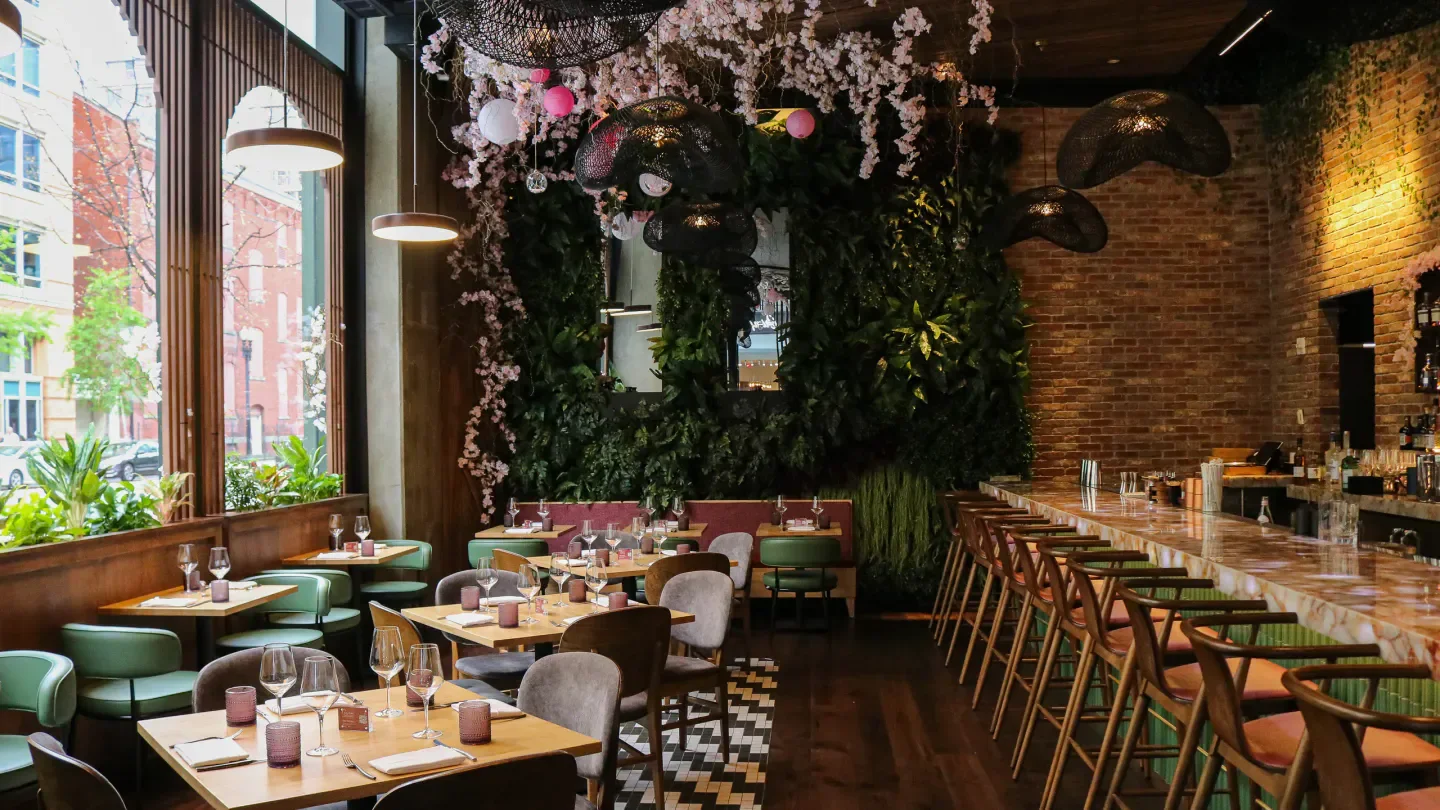 Elegant dining and bar area at Seven Reasons in Washington, DC with floral accents.