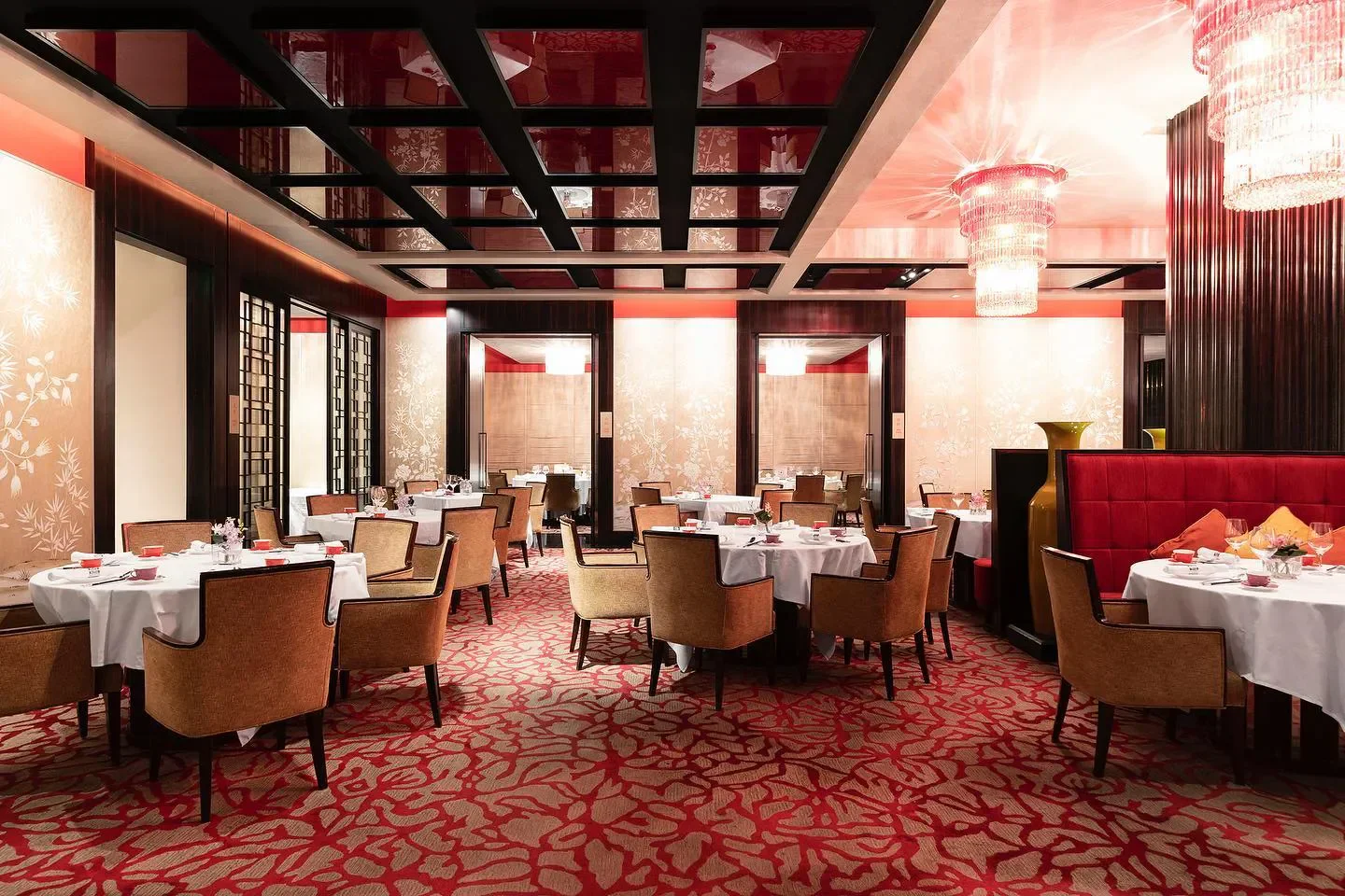 Elegant dining room at Shang Palace - Singapore, with tables set for a meal in Singapore