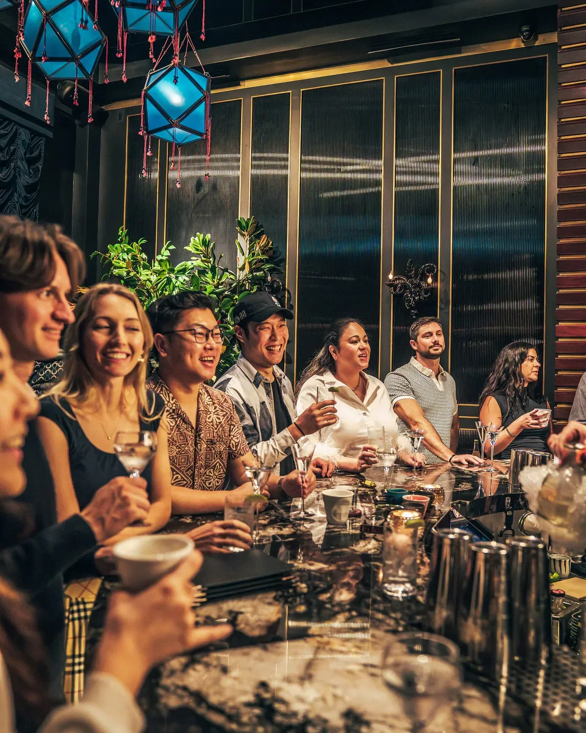 Patrons enjoying cocktails at Shigeyuki in Tokyo's stylish restaurant bar