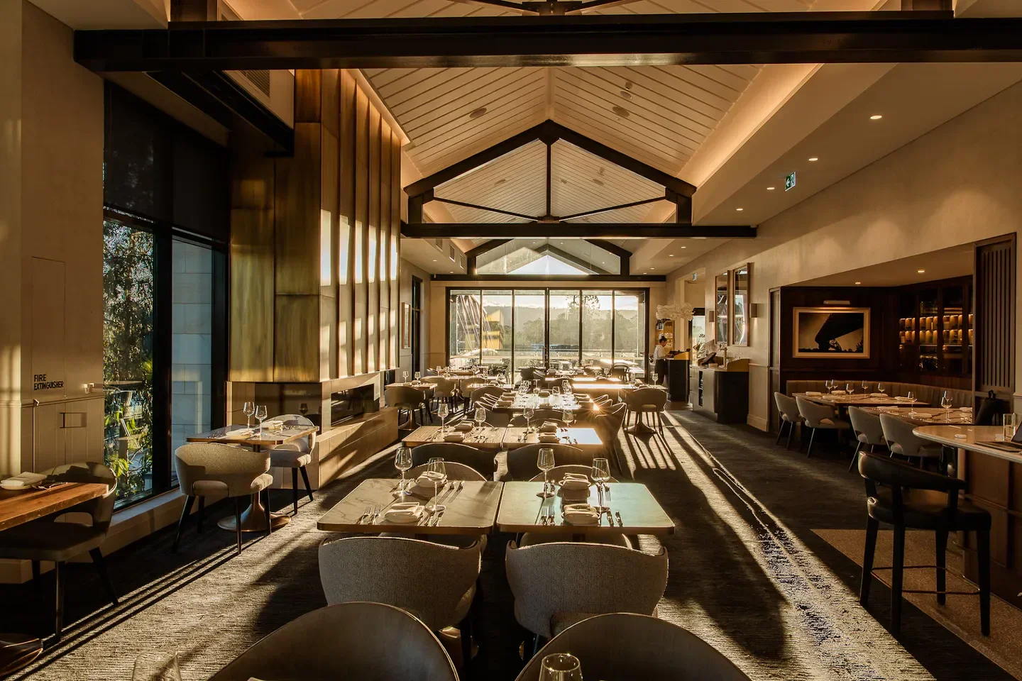 Interior of Sinclair’s restaurant in Sydney, featuring stylish seating and warm lighting.