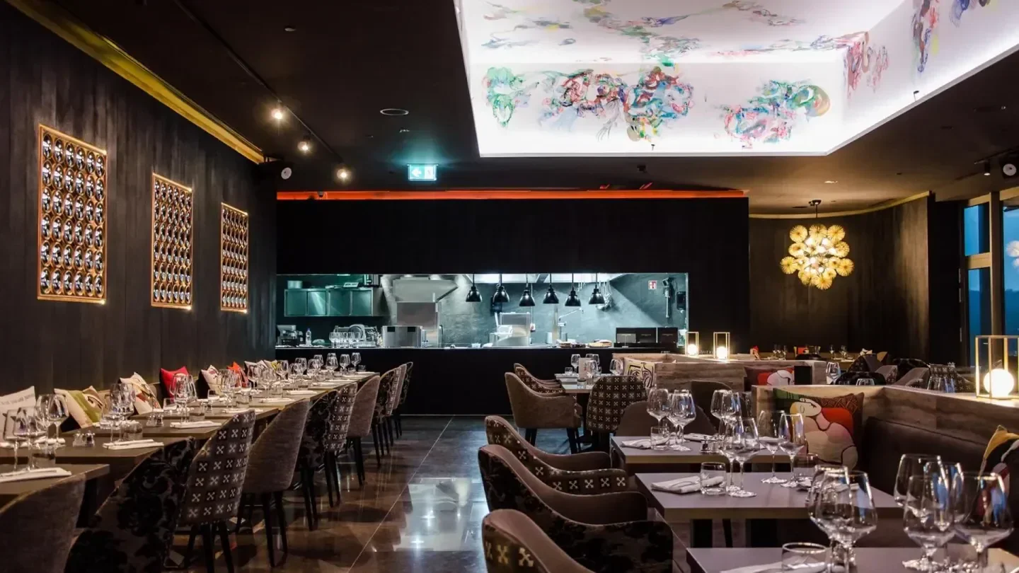 Elegant restaurant interior at Skybar in Luxembourg with tables set for service