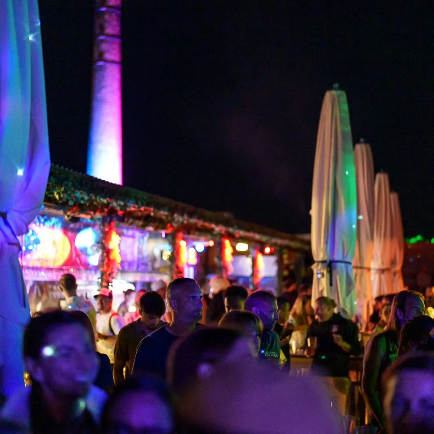 Vibrant nightlife ambiance at Slakthuset nightclub with colorful lights and people enjoying the evening.